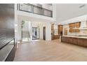 Spacious open-concept living area with wood floors and stairs with iron railing at 1820 Lake Dow Rd, Mcdonough, GA 30252