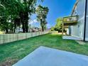 Spacious backyard with a newly installed fence, large grassy area, and a deck on the second story at 3189 A Jackson, Hapeville, GA 30354