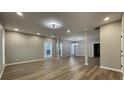 Expansive living room featuring contemporary flooring, neutral paint, recessed lights and an open concept design at 3189 A Jackson, Hapeville, GA 30354
