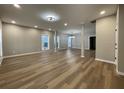 Expansive living room featuring contemporary flooring, neutral paint, recessed lights and an open concept design at 3189 A Jackson, Hapeville, GA 30354