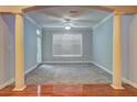 Empty living room featuring gray carpet, large window and classic architectural details at 1203 Stratford Commons Commons, Decatur, GA 30030