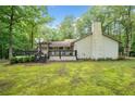 Beautiful backyard featuring a large deck, mature trees, and a serene, private setting at 3252 Custer Lake Drive Northwest Nw Dr, Marietta, GA 30064