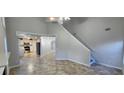 Inviting living room featuring high ceilings and an open floor plan leading to the kitchen at 1230 Chris Lake Dr, Lawrenceville, GA 30046