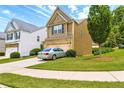 Attractive two-story home showcasing lush lawn and neatly trimmed landscaping at 315 Lakeside Ln, Woodstock, GA 30188