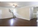 Bright living room with hardwood floors and staircase, perfect for entertaining at 315 Lakeside Ln, Woodstock, GA 30188