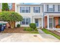 Inviting two-story home showcasing a charming front exterior with a balcony, neat landscaping, and a paved walkway at 2754 Terrell Trace Dr, Marietta, GA 30067