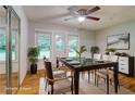 Staged dining room featuring a modern table, rug, and sliding door at 122 Vickery Dr, Fairburn, GA 30213