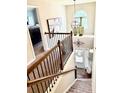 View of the foyer with wooden staircase and decorative vases at 558 Hideaway Dr, Jonesboro, GA 30238