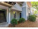 Exterior view of the condo building with stairs and landscaping at 603 Summit North Ne Dr # 603, Atlanta, GA 30324