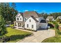 Expansive aerial view of a home, highlighting its landscaped yard, private driveway, and neighborhood setting at 6168 Sweet Birch Ct, Acworth, GA 30101