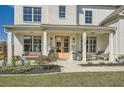 Inviting front porch with comfortable seating, decorative plants, and an attractive entrance at 6168 Sweet Birch Ct, Acworth, GA 30101