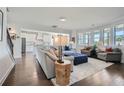 Bright living space with hardwood floors, modern furnishings, and a view to the kitchen at 6168 Sweet Birch Ct, Acworth, GA 30101