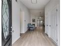 Inviting entryway with high ceilings and wood flooring leading to the spacious living areas at 4490 Epworth Court Ct, Powder Springs, GA 30127