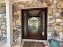 Spacious entryway with stone accents leading to an open living area with hardwood floors at 722 Beauregard Sw Dr, Marietta, GA 30064