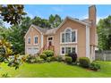 Charming two-story home with a well-manicured lawn and a two-car garage at 920 Highfield Ct, Lawrenceville, GA 30043