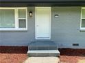 Inviting front door with new steps and modern exterior light fixture at 2107 Garden Cir, Decatur, GA 30032