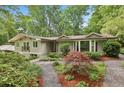 Home featuring excellent landscaping, a brick walkway, and updated architectural elements at 2481 Melinda Ne Dr, Atlanta, GA 30345