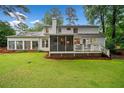 Beautiful backyard with a spacious deck, screened porch, and well maintained lawn at 4333 Collingham Ne Trce, Marietta, GA 30068