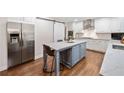 Modern kitchen with stainless steel appliances, center island with seating, and ample counter space at 4333 Collingham Ne Trce, Marietta, GA 30068