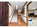 Spacious foyer with hardwood floors, staircase, and trim at 2747 Livsey Trl, Tucker, GA 30084