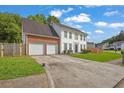 Inviting two-story home with a two-car garage and well-maintained front yard at 3822 River Ridge Ct, Decatur, GA 30034