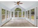 Bright sunroom surrounded by windows, offering natural light and views of the outdoors at 4179 Westchester Ne Xing, Roswell, GA 30075
