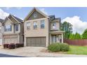 Beautiful two-story townhome featuring a brick exterior, a two-car garage, and well-maintained landscaping at , Lawrenceville, GA 30044