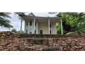 Two-story home featuring a large front porch supported by stately columns at 119 E Johnson St, Temple, GA 30179