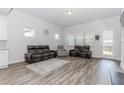 Spacious living area with neutral walls and floors, flooded with natural light at 3397 Long Creek Drive, Buford, GA 30519