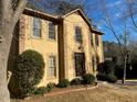 Close-up view of the home's front exterior, showcasing the architectural details and landscaping at 7592 Watson Kaye, Stone Mountain, GA 30087