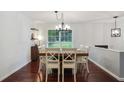 Bright dining room with hardwood floors, a wooden table, and large windows for natural light at 2640 Spring Se Dr, Smyrna, GA 30080
