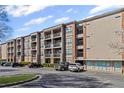 Attractive condominium building featuring a nice exterior, private balconies, and a convenient parking area at 840 United Avenue Southeast # 401, Atlanta, GA 30312