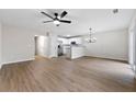 Open-concept living area with new ceiling fan, updated floors, and natural light, great for entertaining and relaxing at 89 Prospect Path, Hiram, GA 30141