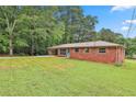 View of the property showing the home's yard space and side exterior details at 191 Pine Ne St, Fairburn, GA 30213