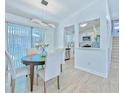 Dining area featuring modern chandelier and a view into the kitchen with stainless appliances at 259 Tarragon Sw Way, Atlanta, GA 30331