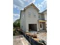 Two-story home with open garage, modern design, and spacious layout at 31 Benscot Dr, Austell, GA 30106