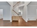 Bright foyer featuring hardwood floors, high ceilings, and an open staircase, creating a welcoming entrance at 11280 Brookhollow Trl, Alpharetta, GA 30022