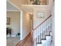 Inviting foyer with hardwood floors and a staircase at 1875 Skidmore Cir, Lawrenceville, GA 30044