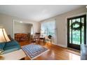 Cozy living room with hardwood floors, a large window, and a decorative rug at 5839 Darry Cir, Norcross, GA 30093