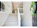 Bright entryway with staircase leading to upper level, and modern decor at 407 Yellowstone Dr, Powder Springs, GA 30127
