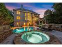 Incredible backyard featuring a pool, hot tub and luxurious lounge area, ideal for entertaining at 979 Pathview Ct, Dacula, GA 30019