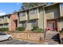 Attractive condo complex featuring a brick facade and well-maintained landscaping at 2220 Runnymead Se Rdg, Marietta, GA 30067
