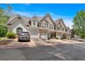 Well-maintained townhomes with attached garages, tidy landscaping, and stone design accents in a pleasant community at 2205 Hoskin Nw Ct # 9, Kennesaw, GA 30144