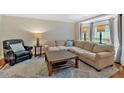 Cozy living room featuring plush seating, a stylish rug, and abundant natural light from the windows at 4 Mount Vernon Cir, Atlanta, GA 30338