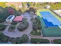 Enjoy an outdoor oasis with a beautiful tennis court, lounge area, and manicured landscaping at 4561 Olde Perimeter Way # 608, Dunwoody, GA 30346