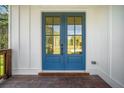 Striking blue double front door with glass panels and white trim, inviting natural light into the home at 2477 Bobbie Dr, Marietta, GA 30066