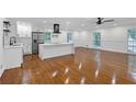 Modern kitchen features a large island, stainless steel appliances, and hardwood floors at 4698 Fellsridge Dr, Stone Mountain, GA 30083