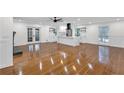 Bright, open-concept living space with beautiful hardwood floors and a modern kitchen at 4698 Fellsridge Dr, Stone Mountain, GA 30083