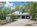 Beautiful home with an attached garage and a long drive at 8464 Pleasant Hill Rd, Lithonia, GA 30058