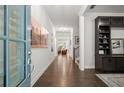 Bright foyer with hardwood floors and views into the living area and staircase at 124 Calder Dr, Alpharetta, GA 30009